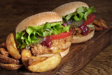 juicy beef burger, french fries, wooden board