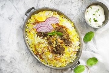 Homemade Beef Biryani served with Raita yogurt dip, overhead view