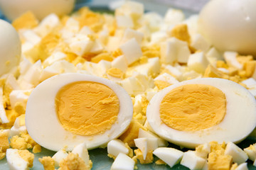 Boiled egg cut in half and also sliced egg