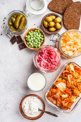 Probiotics food concept. Kimchi, beet sauerkraut, sauerkraut, cottage cheese, peas, olives, bread,...