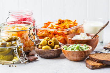 Probiotics food concept. Kimchi, beet sauerkraut, sauerkraut, cottage cheese, peas, olives, bread,...