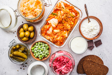Probiotics food concept. Kimchi, beet sauerkraut, sauerkraut, cottage cheese, peas, olives, bread,...