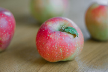 Autumn harvest of red apples on the table.