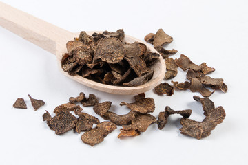 truffless in wooden spoon isolated on white background. Closeup.