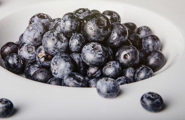 Healthy fruit, strawberry, blueberry, sweet cherry on wooden whi