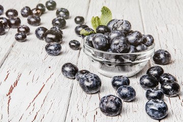 Healthy fruit, strawberry, blueberry, sweet cherry on wooden whi