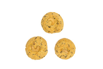 butter cookies with cashew nuts isolated on white background, top view