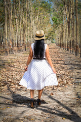 An Asian woman in white dress