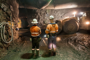 Miner with a large truck known as a 'bogger' underground at a copper mine in NSW, Australia - obrazy, fototapety, plakaty