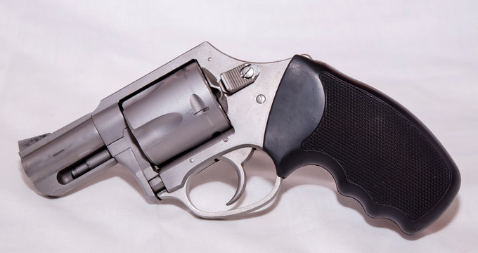 A stainless 357 magnum revolver shown on a white background