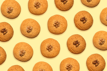 Delicious pattern of honey cookies on a yellow background. View from above