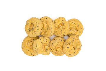 butter cookies with cashew nuts isolated on white background, top view