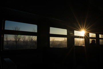 Windows in the train reminiscent of film, each window-a separate frame with its own story