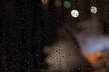 Rain drops on the window at night
