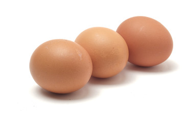 Many eggs on a white scene