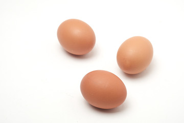 Many eggs on a white scene