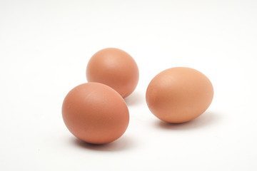 Many eggs on a white scene