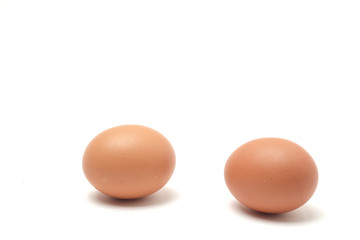 Many eggs on a white scene