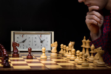 Businessman playing chess game reaching to plan strategy for success, thinking for planning overcoming difficulty and achieving goals business strategy for win, management or leadership concept.