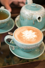 Hot coffee is placed on the table.