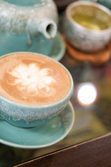 Hot coffee is placed on the table.