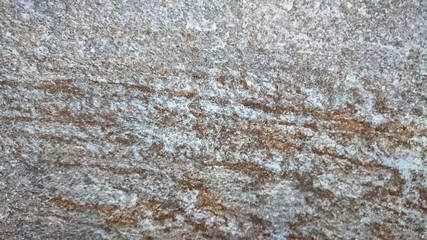 The abstract background of old gray wall with natural cement texture in selective focus