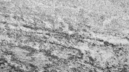 The abstract background of old gray wall with natural cement texture in selective focus