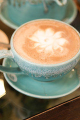 Hot coffee is placed on the table.