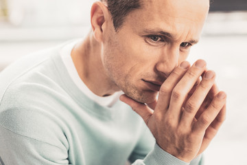 Dark-eyed man feeling terrible after breakup