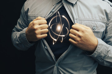 Business man in shirt with a picture Atom.