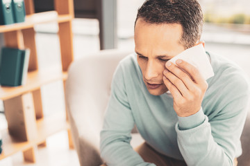 Mature man suffering from strong migraine