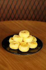 Fried donut with sugar, popular sweet  sold in market or restaurant, high calories, sugar and cholesterol level cause of many chronic disease such as diabetes and heart disease affect economic problem