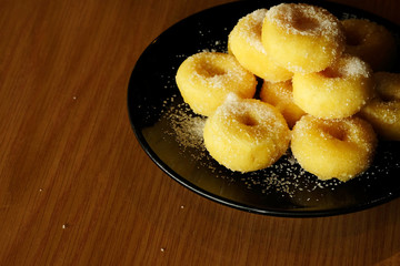 Fried donut with sugar, popular sweet  sold in market or restaurant, high calories, sugar and cholesterol level cause of many chronic disease such as diabetes and heart disease affect economic problem