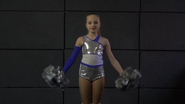 Girl In Costumes With Pompons Make Element Acrobatic