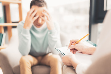 Psychoanalyst making notes during working visit