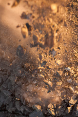 Crushed ore from a copper mine in NSW Australia dropping onto a rock pile