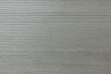 Light wood texture background. Embossed design of wooden strips of material, solid color background.