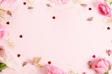 Obraz na płótnie Canvas Festive flower composition on pink background. Overhead view