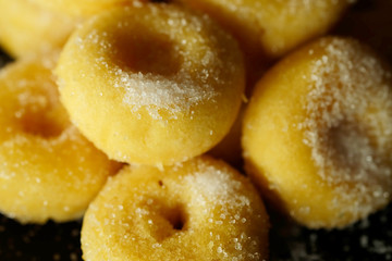 Fried donut with sugar, popular sweet  sold in market or restaurant, high calories, sugar and cholesterol level cause of many chronic disease such as diabetes and heart disease affect economic problem