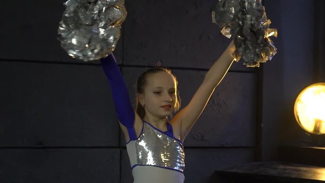 Cheerleader Cheering With Her Pom-Poms