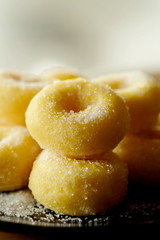 Fried donut with sugar, popular sweet  sold in market or restaurant, high calories, sugar and cholesterol level cause of many chronic disease such as diabetes and heart disease affect economic problem