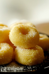 Fried donut with sugar, popular sweet  sold in market or restaurant, high calories, sugar and cholesterol level cause of many chronic disease such as diabetes and heart disease affect economic problem