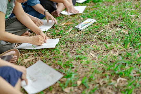 Asian Guys In The Garden Workshop And Have Acted Together.