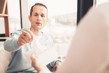 Curious stressed man visiting psychotherapist