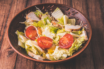 Vegetables in a salad, vegetable salad with Turkey. Cabbage and red tomatoes. Concept: healthy and low-calorie feeding. Diet products