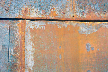 Background of rusty shell of ship at shipyard for maintenance