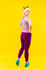 Fototapeta na wymiar Woman feeling excited while doing sport and losing weight