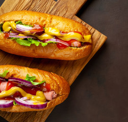 homemade hot dogs on concrete background, slate
