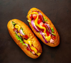 homemade hot dogs on concrete background, slate