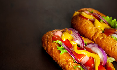 homemade hot dogs on concrete background, slate